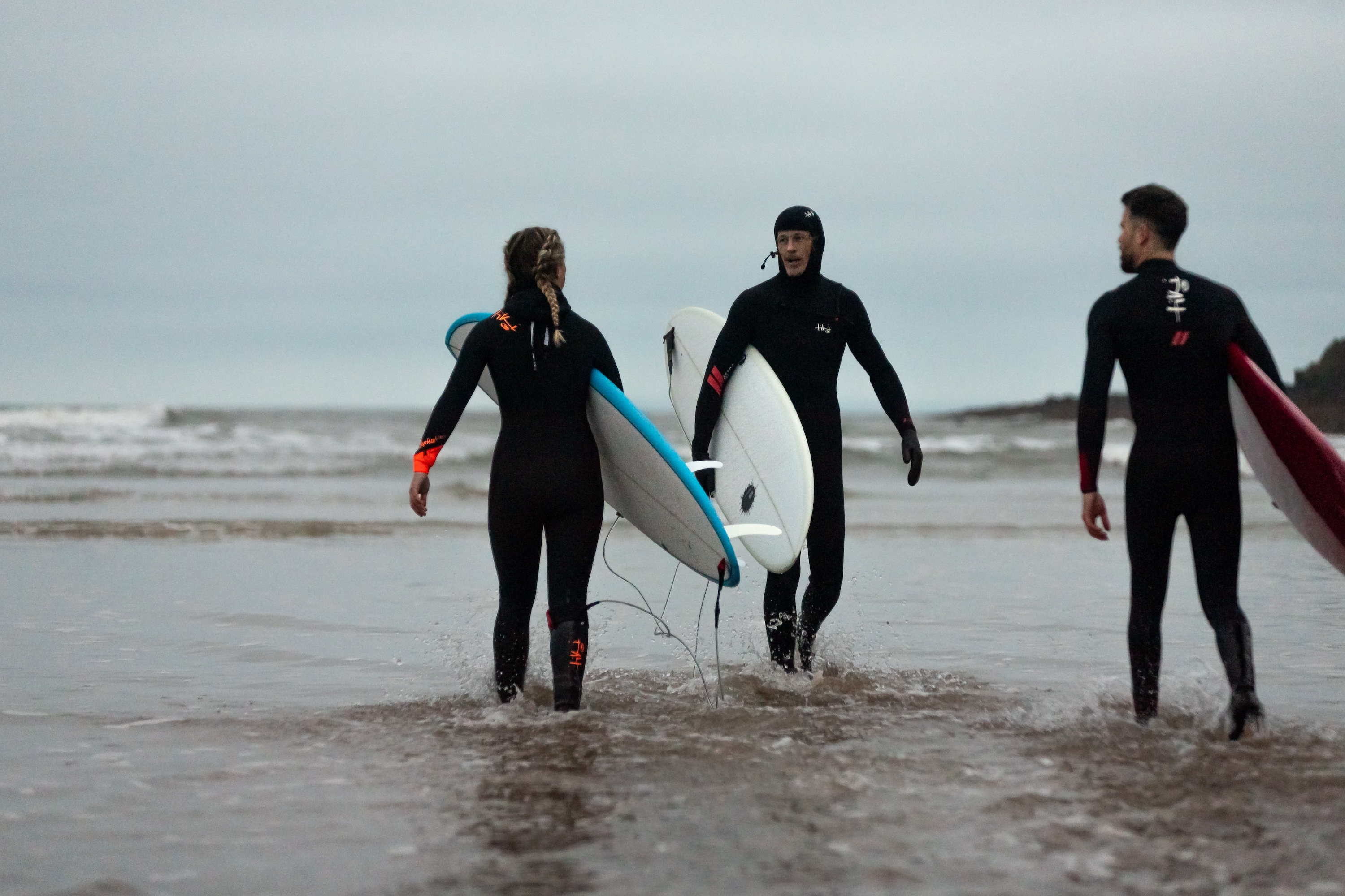 Surfer wearing wetsuit doing a turn on a wave